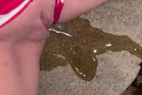 Girl pulls panties to the side to piss on steps