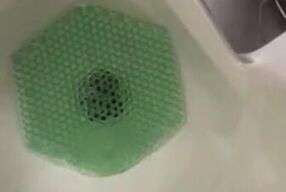 Almost Caught in action at the urinal Pinching off/on Janitor saw wet floor