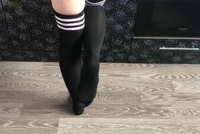 teen girl show her college knee high black socks