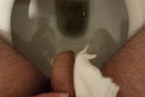 Pee. He wiped the urine drops with a napkin. He rolled off the wet shiny head. I dream that my wife