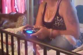 Nerdy pretty country girl in tight jeans playing video games
